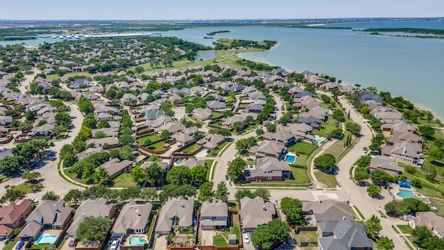 birds eye view of property featuring a water view and a residential view