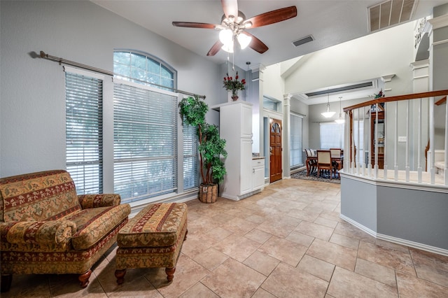 interior space with visible vents, baseboards, and ceiling fan