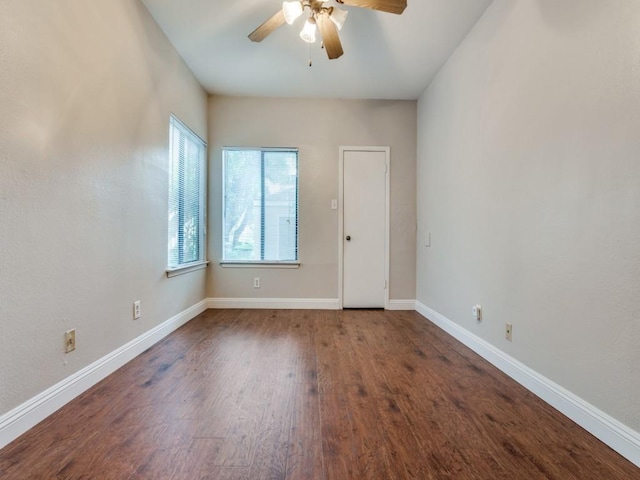 5550 Spring Valley Rd Unit F12, Dallas, TX 75254 - empty room with ceiling fan, dark wood-type flooring, and baseboards