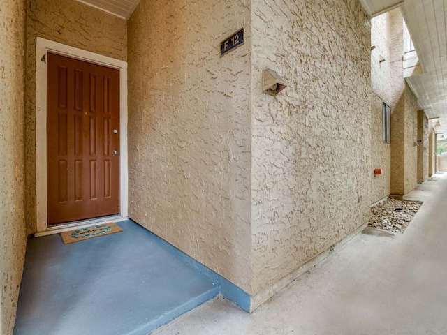 5550 Spring Valley Rd Unit F12, Dallas, TX 75254 - property entrance featuring stucco siding