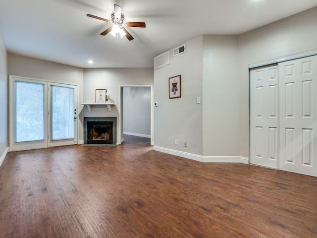 5550 Spring Valley Rd Unit F12, Dallas, TX 75254 - unfurnished living room with ceiling fan, baseboards, dark wood-style flooring, a tiled fireplace, and recessed lighting