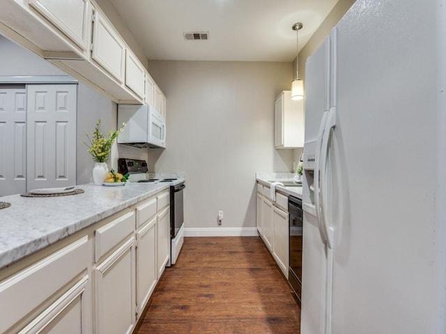 5550 Spring Valley Rd Unit F12, Dallas, TX 75254 - kitchen with white appliances, dark wood-style flooring, white cabinetry, and decorative light fixtures