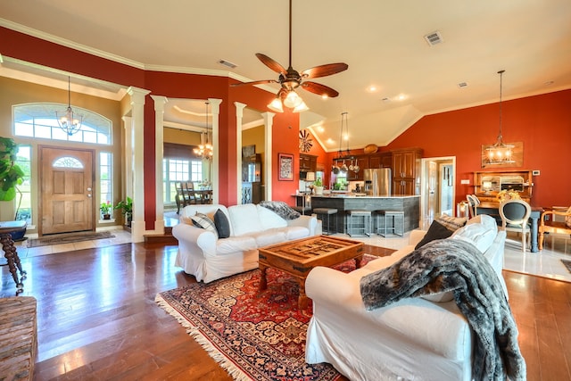 900 Fm 1139, Rockwall, TX 75032 - living area with ceiling fan with notable chandelier, ornamental molding, ornate columns, visible vents, and wood-type flooring