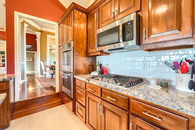 900 Fm 1139, Rockwall, TX 75032 - kitchen with a wealth of natural light, visible vents, appliances with stainless steel finishes, a kitchen island, and ornamental molding