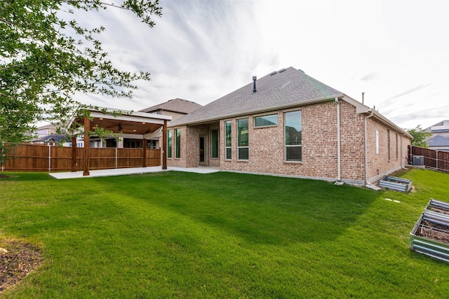 1451 Silver Sage Dr, Haslet, TX 76052 - back of property featuring a patio area, brick siding, roof with shingles, central AC, and a ceiling fan