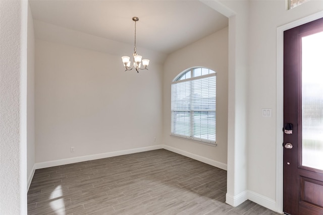 1451 Silver Sage Dr, Haslet, TX 76052 - foyer featuring wood finished floors, a chandelier, baseboards, and lofted ceiling
