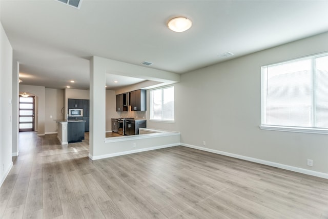 4444 Pentridge Dr, Fort Worth, TX 76036 - unfurnished living room featuring visible vents, light wood-style flooring, baseboards, and recessed lighting
