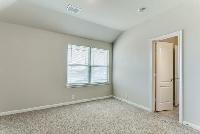 4444 Pentridge Dr, Fort Worth, TX 76036 - spare room with light colored carpet, visible vents, baseboards, and lofted ceiling