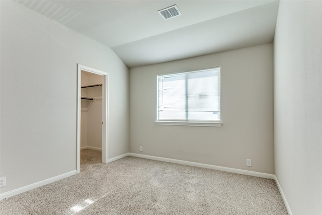 4444 Pentridge Dr, Fort Worth, TX 76036 - unfurnished bedroom with carpet flooring, vaulted ceiling, visible vents, and a spacious closet