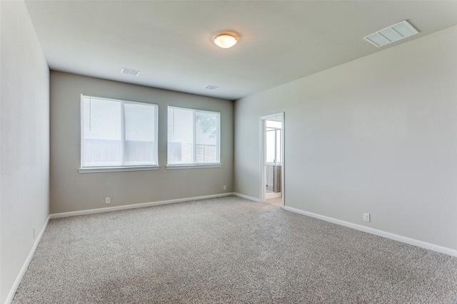 4444 Pentridge Dr, Fort Worth, TX 76036 - empty room with visible vents, baseboards, and light carpet