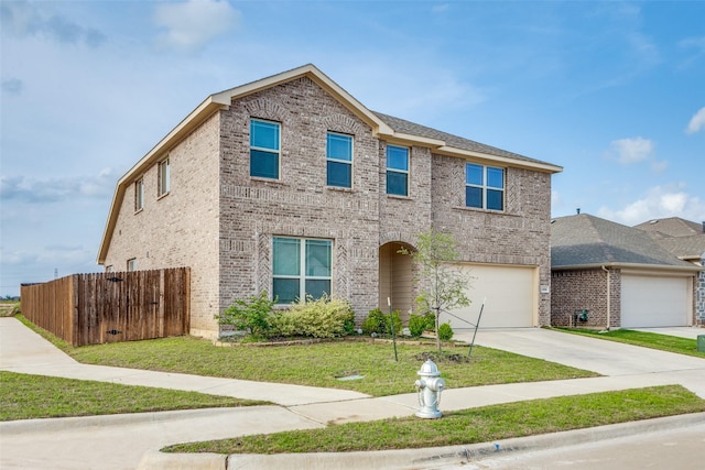 4444 Pentridge Dr, Fort Worth, TX 76036 - traditional-style home featuring a garage, fence, a front lawn, brick siding, and driveway
