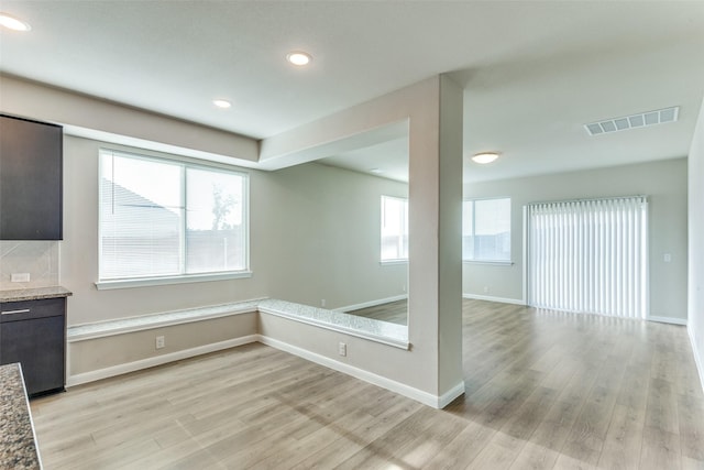 4444 Pentridge Dr, Fort Worth, TX 76036 - empty room with baseboards, recessed lighting, light wood-style flooring, and visible vents