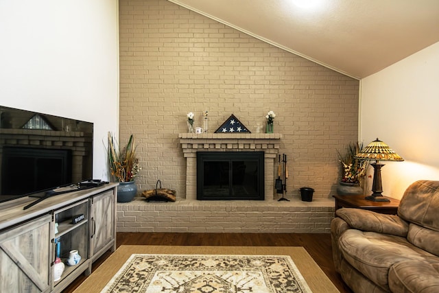 2100 Albert Broadfoot, Bonham, TX 75418 - living area featuring a brick fireplace, vaulted ceiling, dark wood finished floors, and brick wall