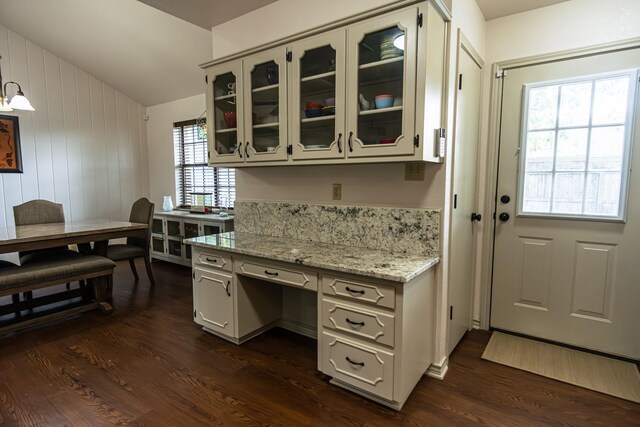 2100 Albert Broadfoot, Bonham, TX 75418 - kitchen featuring dark wood-style floors, glass insert cabinets, vaulted ceiling, light stone counters, and an office area