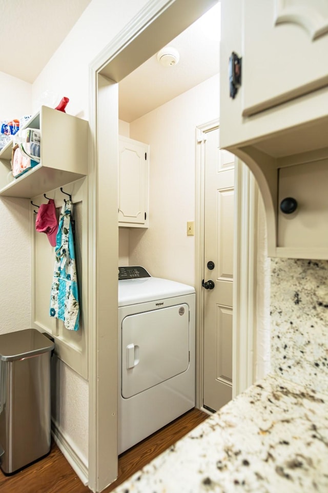 2100 Albert Broadfoot, Bonham, TX 75418 - washroom featuring washer / dryer, dark wood-style floors, and cabinet space