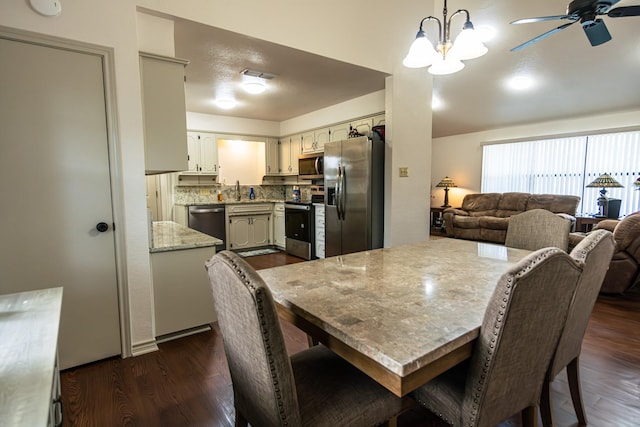 2100 Albert Broadfoot, Bonham, TX 75418 - dining room with dark wood-style floors, ceiling fan, and a chandelier