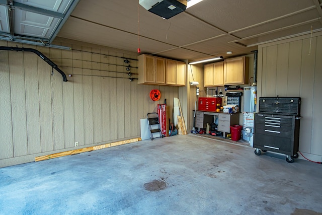 2100 Albert Broadfoot, Bonham, TX 75418 - garage with a workshop area, a garage door opener, and wooden walls