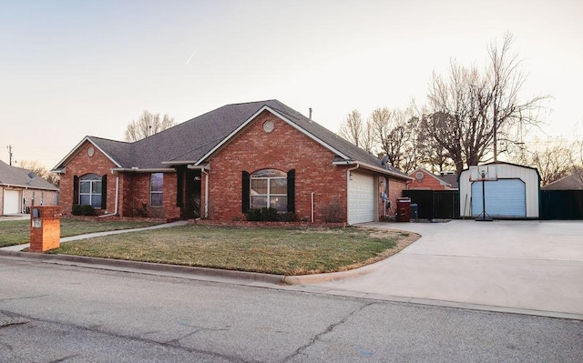 710 Mockingbird St, Bonham, TX 75418 - ranch-style house with brick siding, a garage, concrete driveway, roof with shingles, and a front lawn