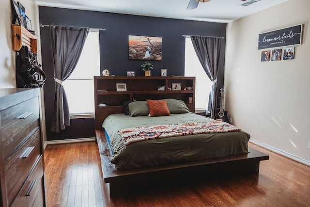 710 Mockingbird St, Bonham, TX 75418 - bedroom with visible vents, wood finished floors, and baseboards