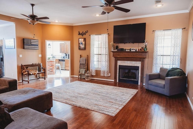 710 Mockingbird St, Bonham, TX 75418 - living area with baseboards, a ceiling fan, and hardwood / wood-style floors