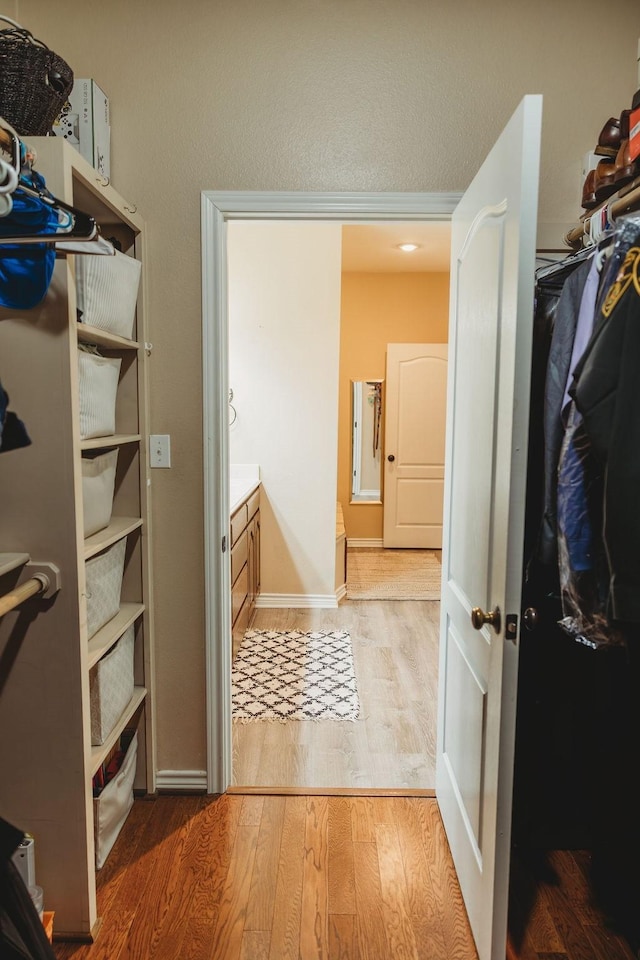 710 Mockingbird St, Bonham, TX 75418 - walk in closet with wood finished floors