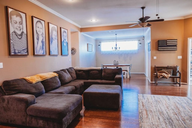710 Mockingbird St, Bonham, TX 75418 - living area featuring ornamental molding, ceiling fan with notable chandelier, dark wood-type flooring, and baseboards