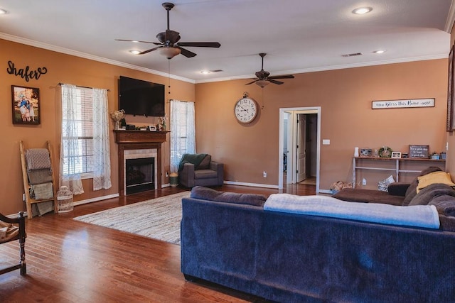 710 Mockingbird St, Bonham, TX 75418 - living area with ornamental molding, visible vents, baseboards, and ceiling fan