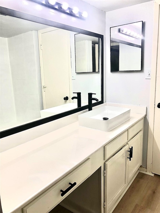 9601 Walnut St Unit 5101, Dallas, TX 75243 - full bathroom featuring vanity and wood finished floors