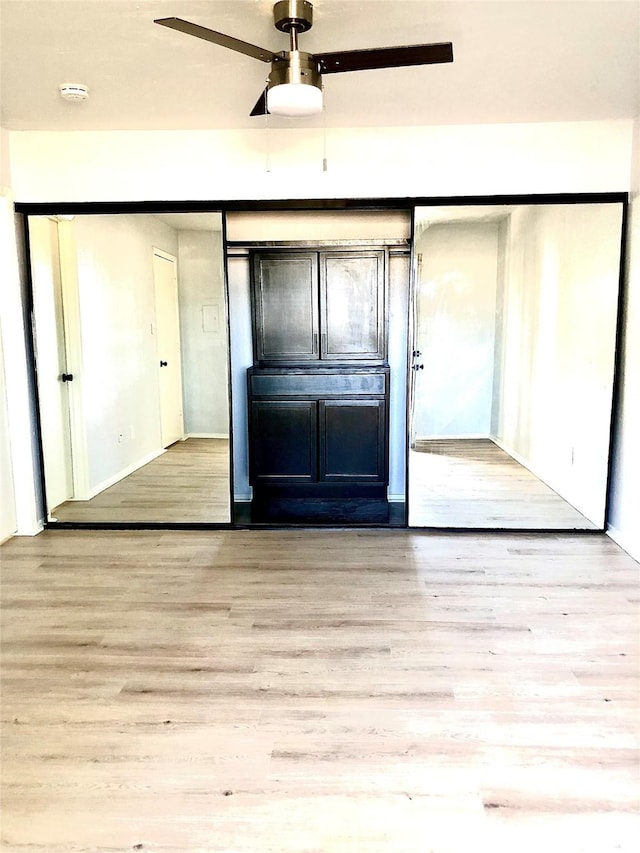 9601 Walnut St Unit 5101, Dallas, TX 75243 - unfurnished bedroom featuring wood finished floors and baseboards
