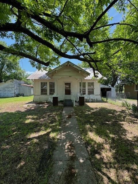 409 E College St, Leonard, TX 75452 - bungalow-style house featuring fence and metal roof