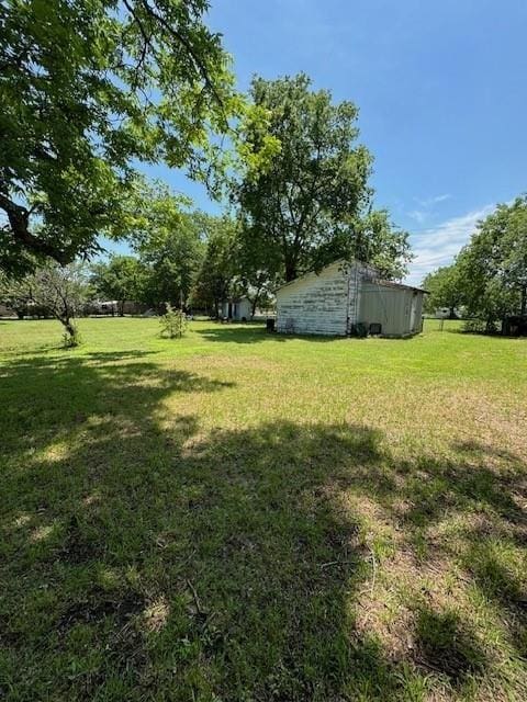 409 E College St, Leonard, TX 75452 - view of yard with an outdoor structure