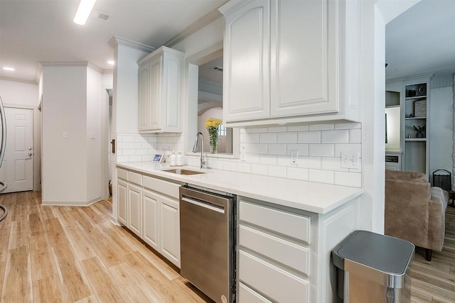 3711 Winding Way, Granbury, TX 76049 - kitchen featuring dishwasher, ornamental molding, a sink, backsplash, and light countertops