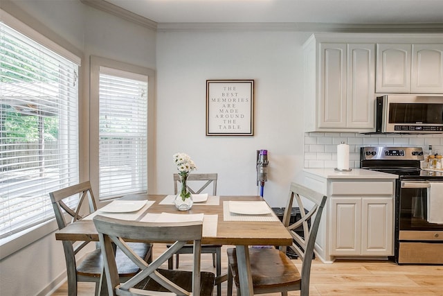 3711 Winding Way, Granbury, TX 76049 - dining room with light wood finished floors and ornamental molding