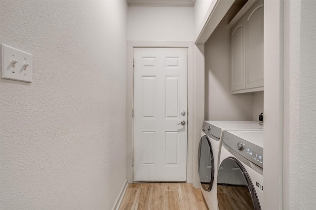 3711 Winding Way, Granbury, TX 76049 - clothes washing area featuring cabinet space, separate washer and dryer, light wood finished floors, a textured wall, and baseboards