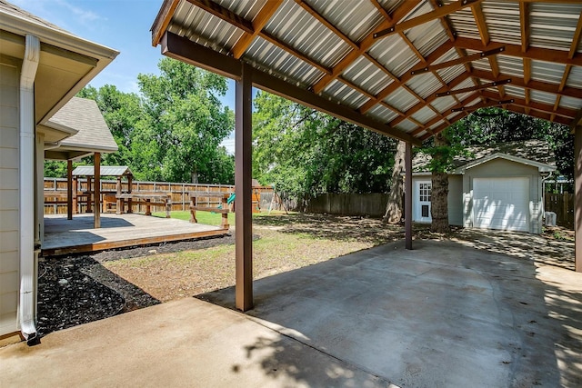 3711 Winding Way, Granbury, TX 76049 - view of patio featuring a fenced backyard, an outdoor structure, and a deck