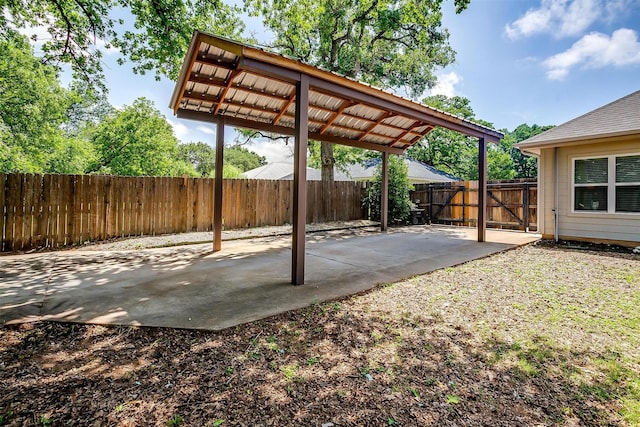 3711 Winding Way, Granbury, TX 76049 - view of patio / terrace with a fenced backyard and a carport