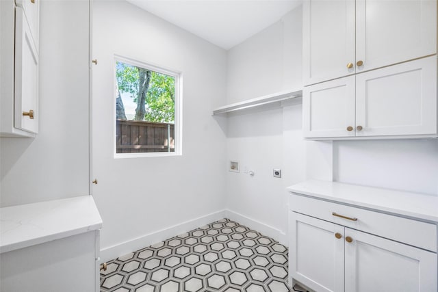 2212 Ridge Crest Dr, Richardson, TX 75080 - laundry room with cabinet space, washer hookup, baseboards, and hookup for an electric dryer