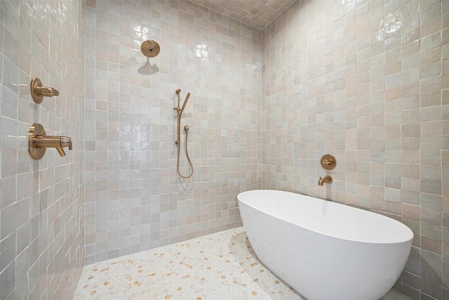 2212 Ridge Crest Dr, Richardson, TX 75080 - full bath featuring a soaking tub, tile walls, and tiled shower