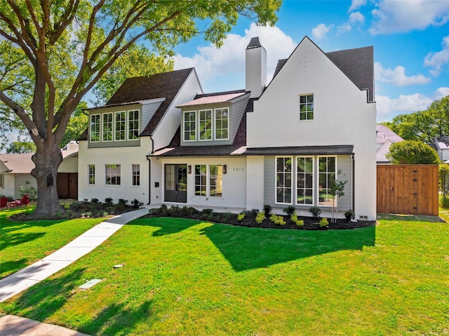 2212 Ridge Crest Dr, Richardson, TX 75080 - view of front of home with a chimney, a front yard, a shingled roof, and fence