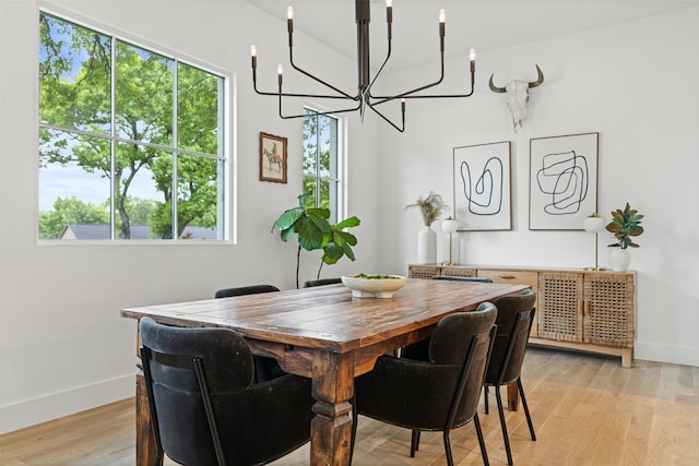 2212 Ridge Crest Dr, Richardson, TX 75080 - dining room with a chandelier, baseboards, and light wood-type flooring
