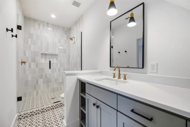 2212 Ridge Crest Dr, Richardson, TX 75080 - full bath with toilet, vanity, visible vents, and a stall shower