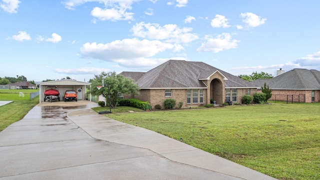 10121 Fireside Ln, Forney, TX 75126 - view of front of property with a front lawn, driveway, and a carport