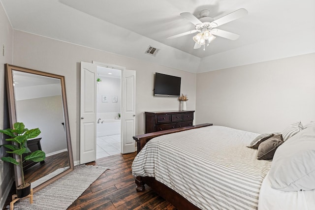 10121 Fireside Ln, Forney, TX 75126 - bedroom with a tray ceiling, baseboards, a ceiling fan, and dark wood-style floors
