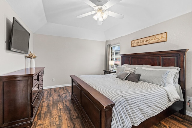 10121 Fireside Ln, Forney, TX 75126 - bedroom with a tray ceiling, dark wood-style flooring, baseboards, and ceiling fan