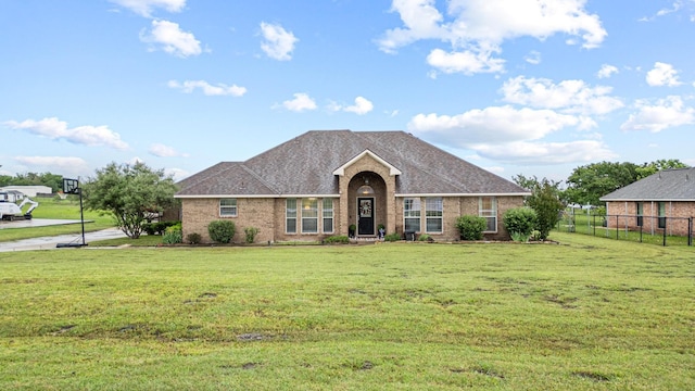 10121 Fireside Ln, Forney, TX 75126 - ranch-style home with fence, brick siding, and a front yard