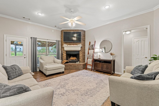 10121 Fireside Ln, Forney, TX 75126 - living area with ceiling fan, ornamental molding, visible vents, and wood finished floors