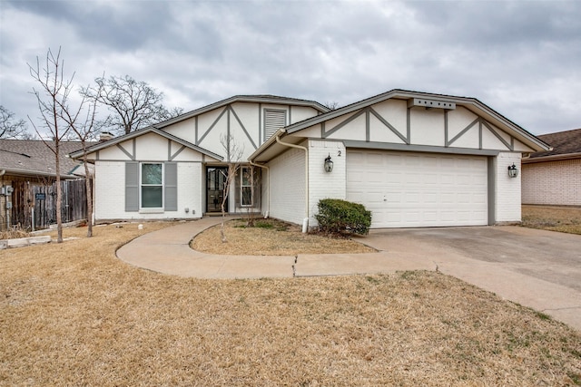 2 Preston Trail Ct, Pantego, TX 76013 - english style home featuring driveway, brick siding, an attached garage, and fence