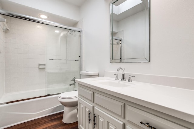 2 Preston Trail Ct, Pantego, TX 76013 - full bathroom featuring toilet, vanity, enclosed tub / shower combo, and wood finished floors