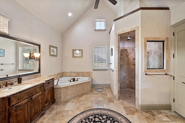 full bath with a tile shower, vanity, a ceiling fan, and a bath