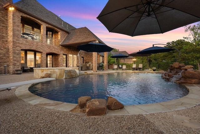 pool with a patio area